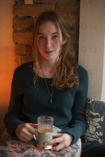 Portrait of Caucasian woman drinking beverage