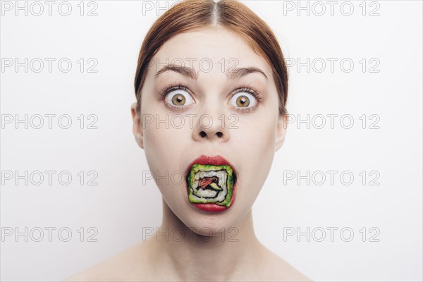 Caucasian woman with mouthful of sushi