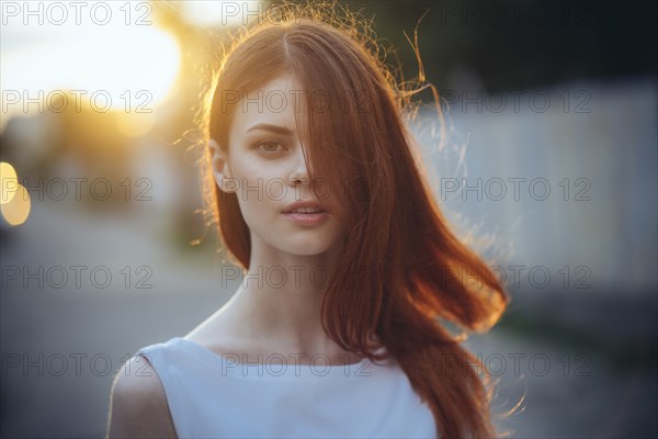 Portrait of Caucasian woman with hair covering face