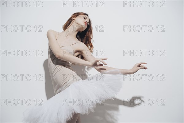 Caucasian woman dancing wearing tutu