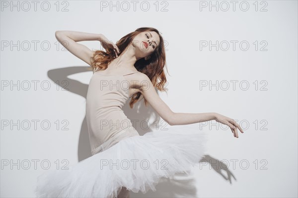 Caucasian woman dancing wearing tutu