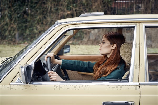 Caucasian woman driving car