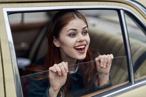 Caucasian Woman Smiling In Back Seat Of Car Photo12 Tetra Images Dmitry Ageev