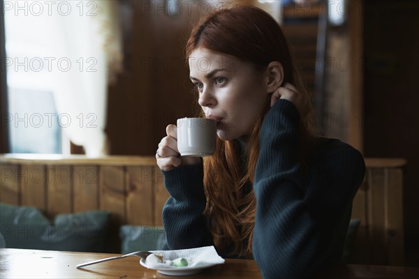 Woman drinking coffee in cafe