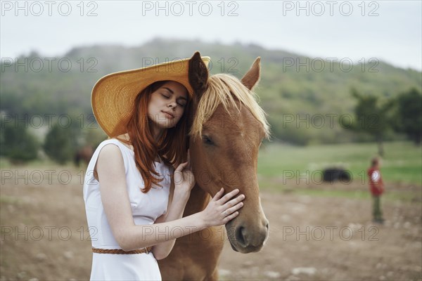 Woman petting horse