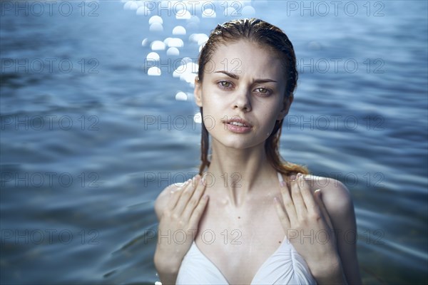 Serious woman wearing a bikini in ocean