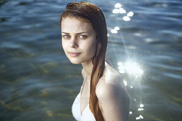 Serious woman in ocean