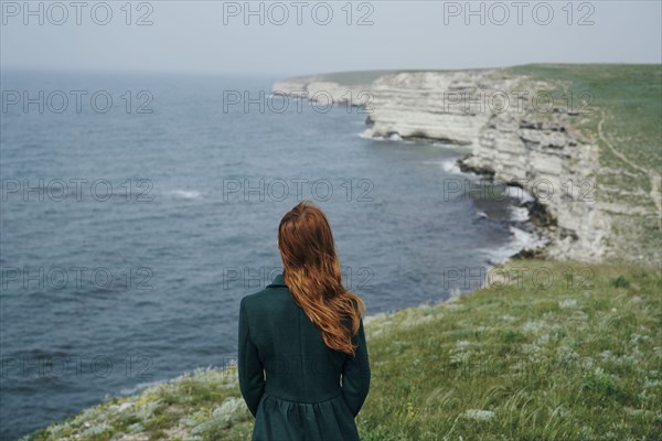 Caucasian woman admiring ocean