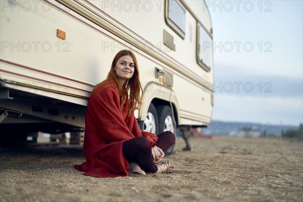 Caucasian woman leaning on motor home
