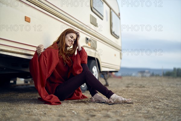 Caucasian woman leaning on motor home