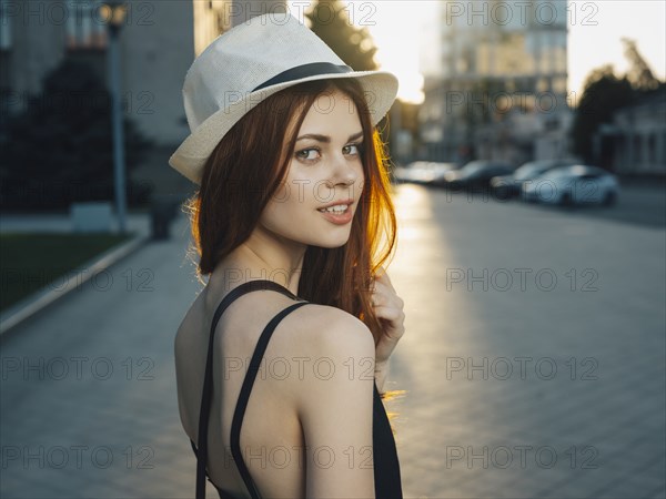 Smiling Caucasian woman in city