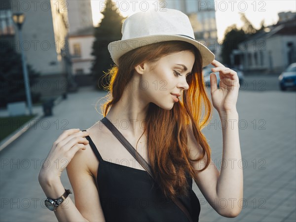 Smiling Caucasian woman in city