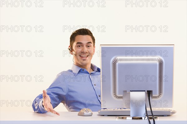 Portrait of businessman at computer