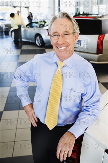 Car salesman smiling