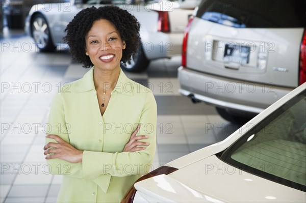 Car saleswoman smiling