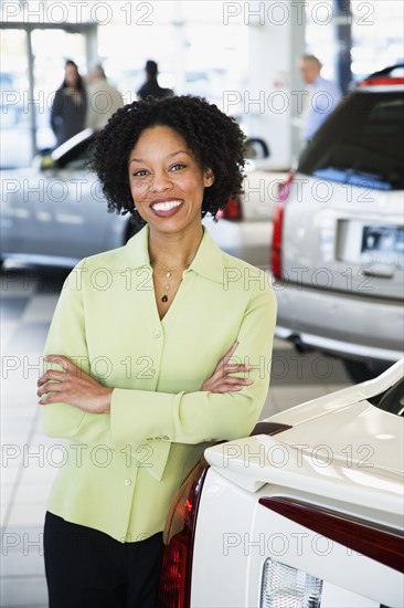 Car saleswoman smiling