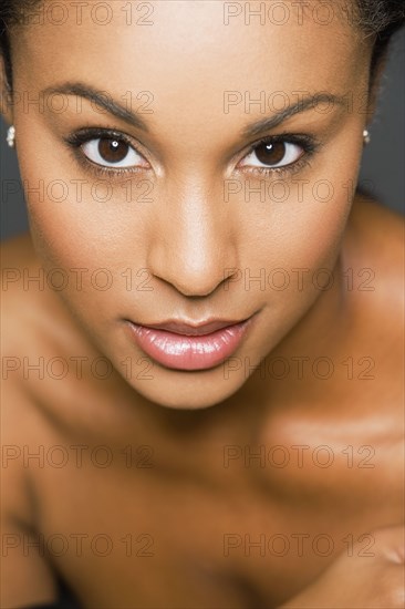 Close up of Hispanic woman with bare shoulders