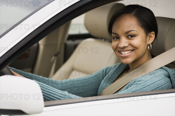 African woman sitting in car