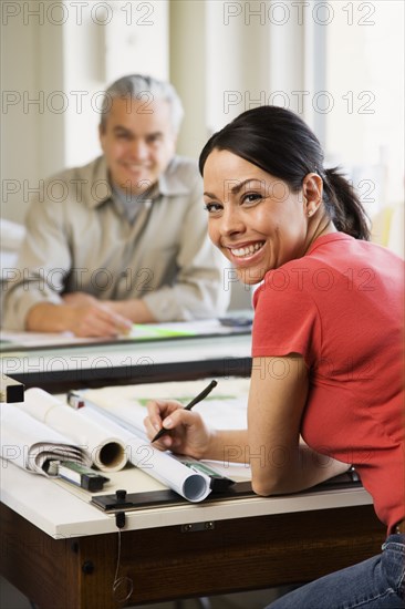 Hispanic female architect at desk