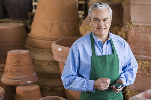 Hispanic man working at garden center