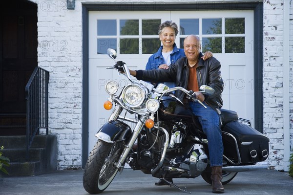 Senior African American couple on motorcycle