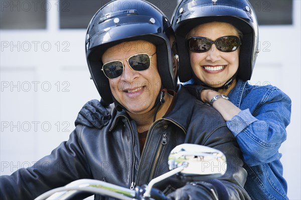 Senior African American couple on motorcycle