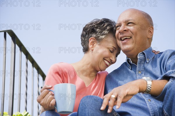 Senior African American couple hugging