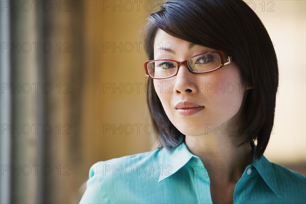 Close up of Asian woman wearing eyeglasses