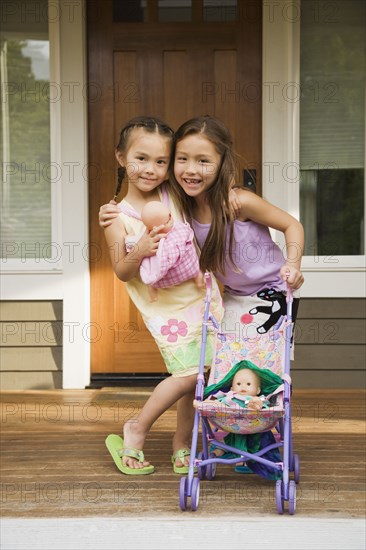 Asian sisters hugging