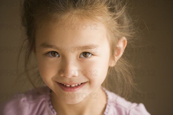 Close up of Asian girl smiling