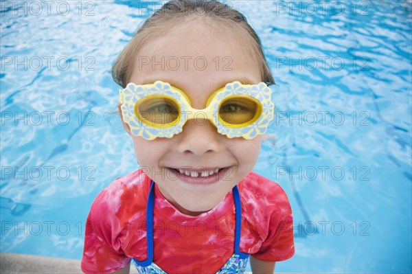 Young Asian girl wearing fancy goggles