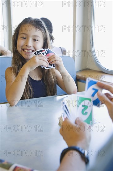 Asian girl playing cards