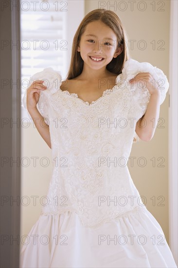 Asian girl trying on wedding dress