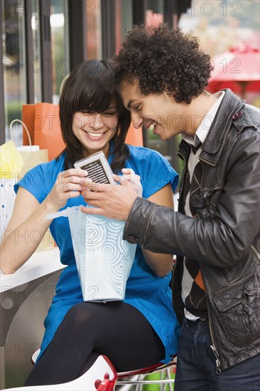 Couple looking in shopping bag