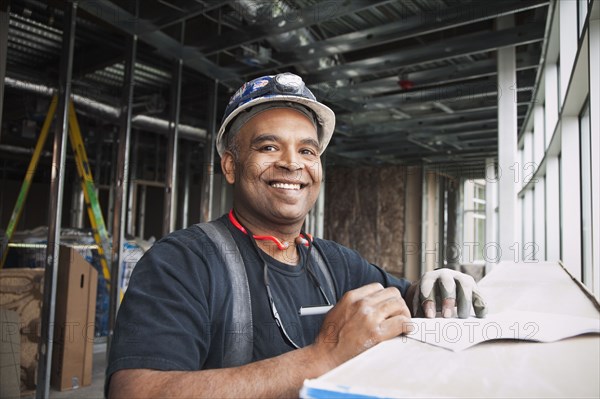 Mixed race worker on construction site