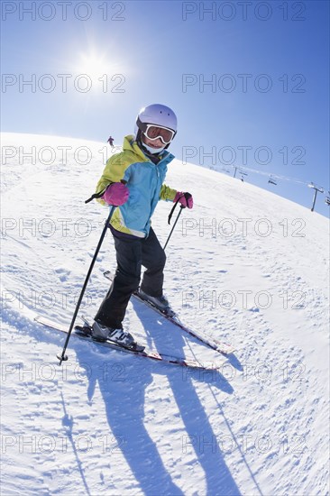 Mixed race girl skiing downhill