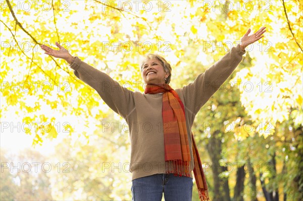 Mixed race woman standing in park