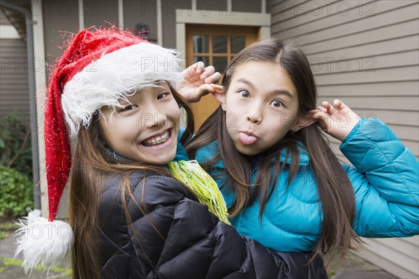 Mixed race girls making faces