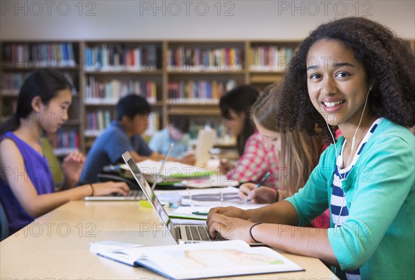 Student using laptop in library