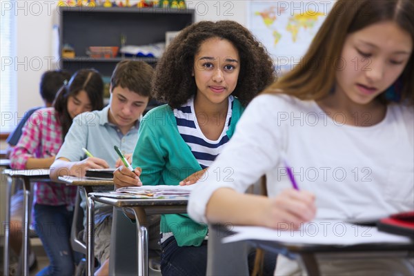 Students taking notes in class