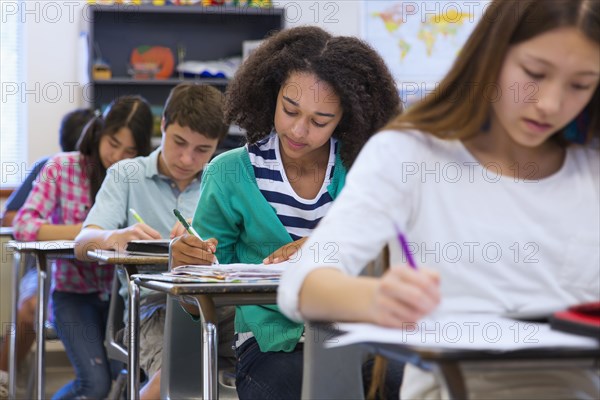 Students taking notes in class