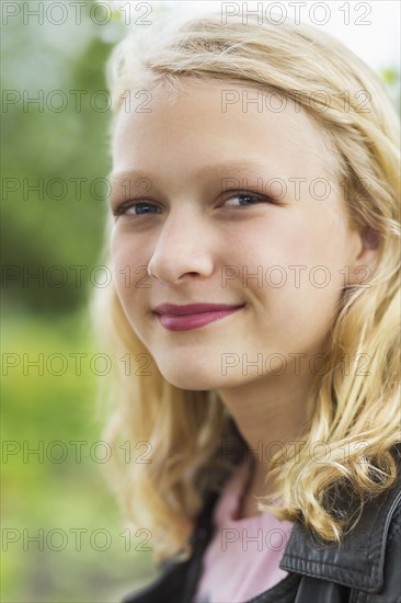 Caucasian girl smiling outdoors