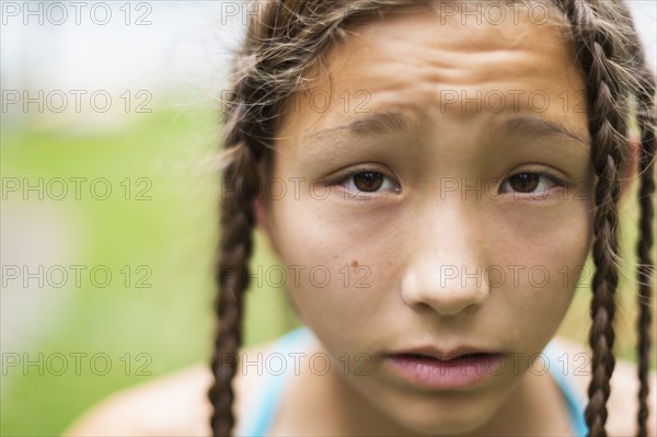 Mixed race girl with braids