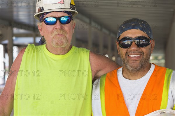 Workers smiling at construction site