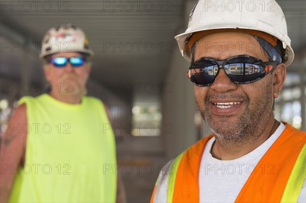 Workers smiling at construction site