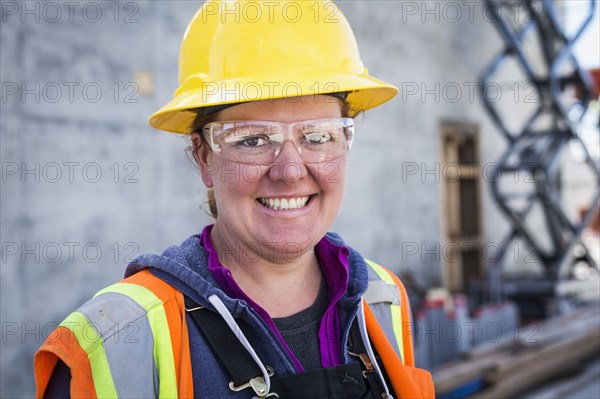Caucasian worker wearing safety goggles on site