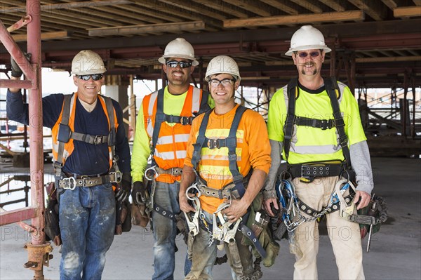 Workers smiling at construction site