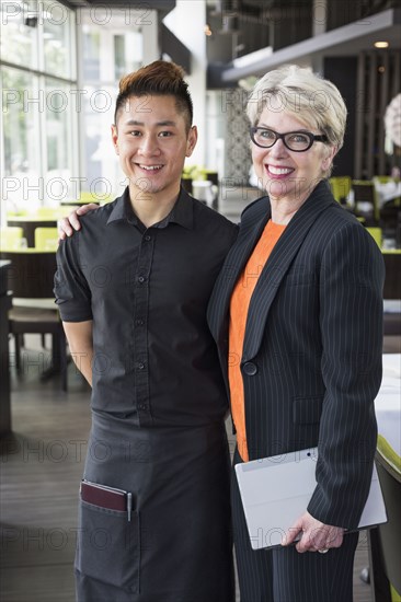 Businesswoman and water smiling in restaurant