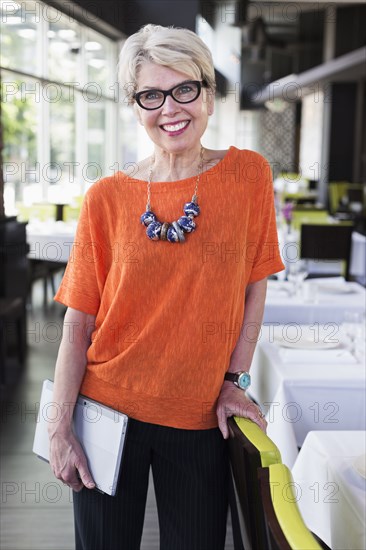 Caucasian woman smiling in restaurant