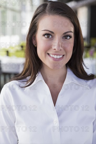 Caucasian waitress smiling in restaurant